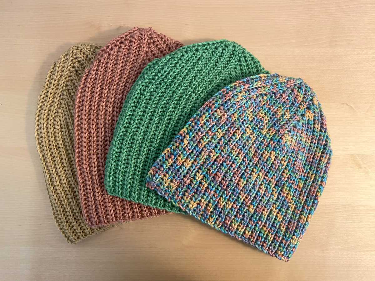 four crochet beanies